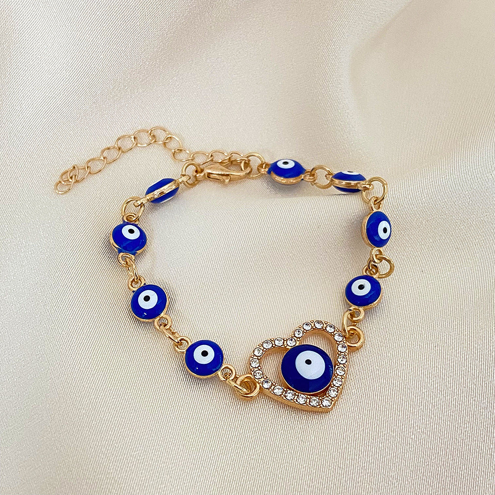 Wholesale Devil's Eye Hollow Diamond Heart Drip Oil Eye Alloy Bracelet